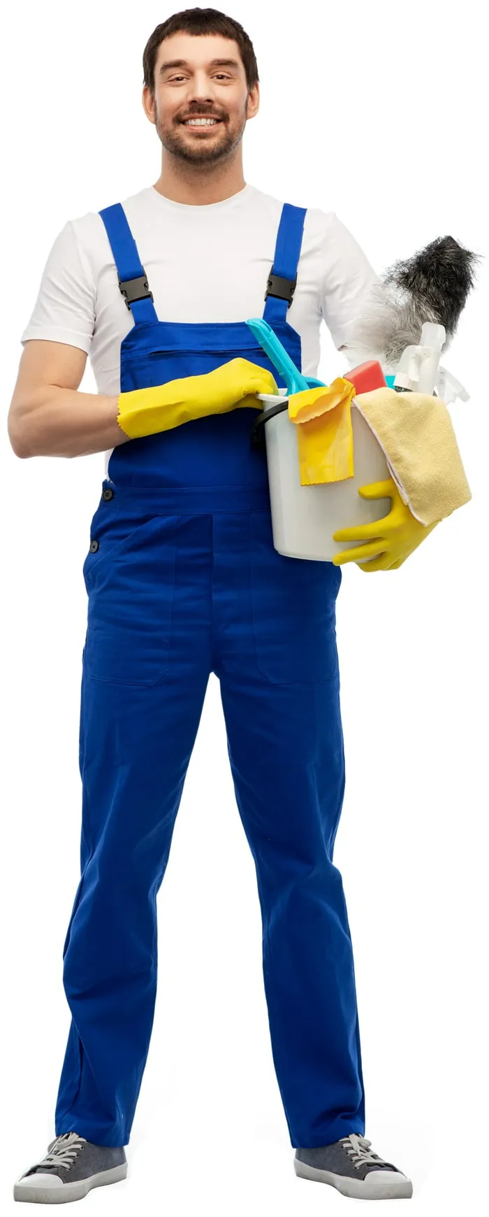 happy smiling male worker or cleaner in overal and gloves with cleaning supplies over white background